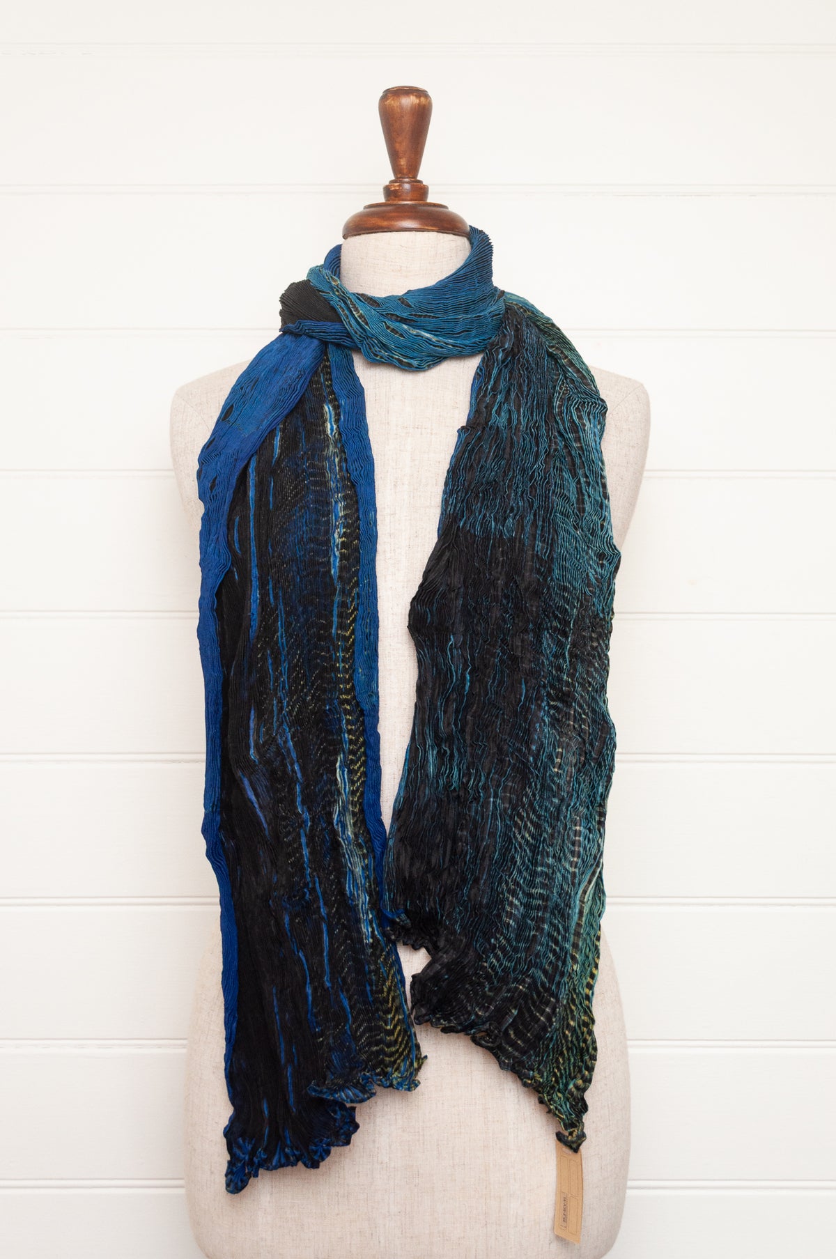 Neeru Kumar shibori dyed pure silk crinkle scarf in blues and greens with black and white speckled details.