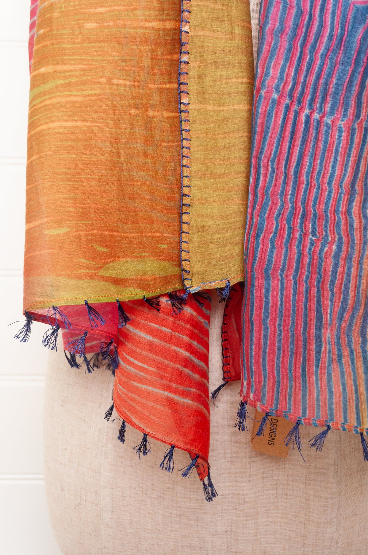 Neeru Kumar shibori dyed cotton silk scarf in rainbow colours, with navy handstitching and tassels.