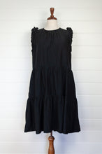 Load image into Gallery viewer, Valia made in Melbourne NYE little black dress in black silk cotton, tiered skirt and ruffles at the shoulder.