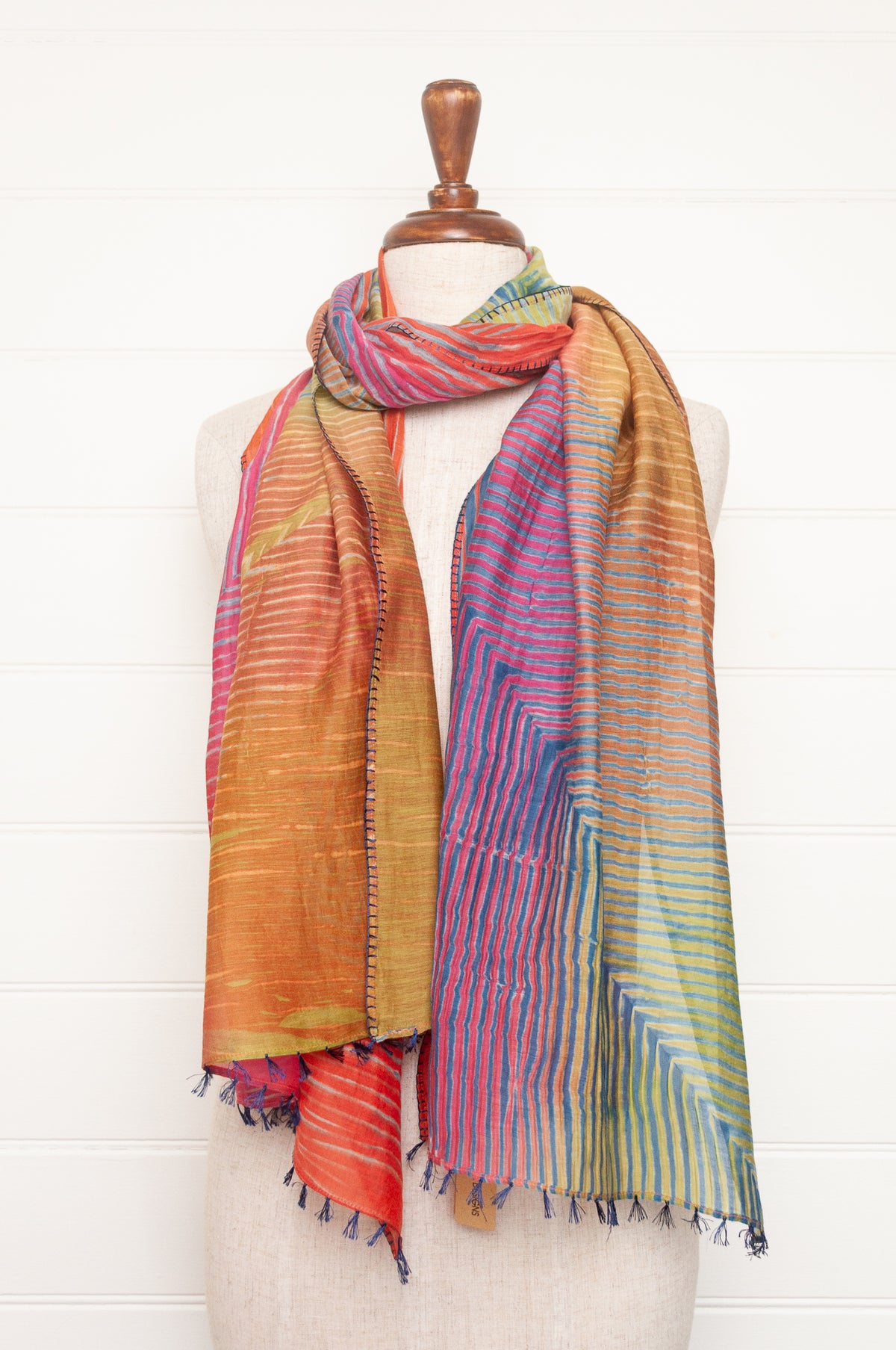 Neeru Kumar shibori dyed cotton silk scarf in rainbow colours, with navy handstitching and tassels.