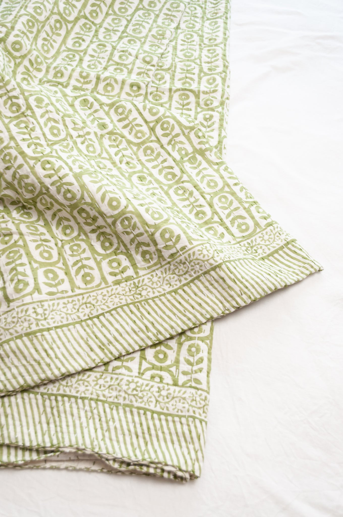 Kantha quilt blockprint pure cotton in floral sage green on white pattern.