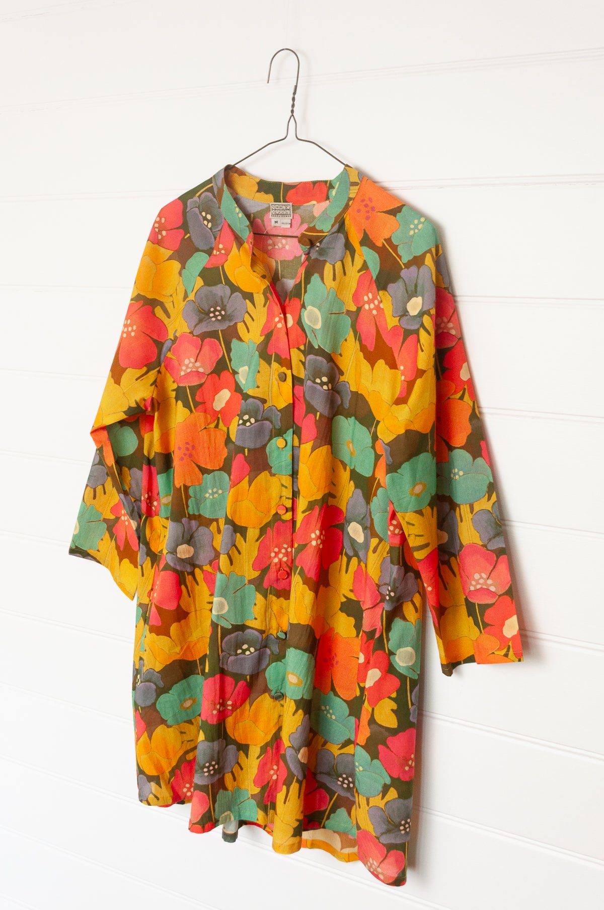 Neeru Kumar button-up shirt with a colorful floral pattern.