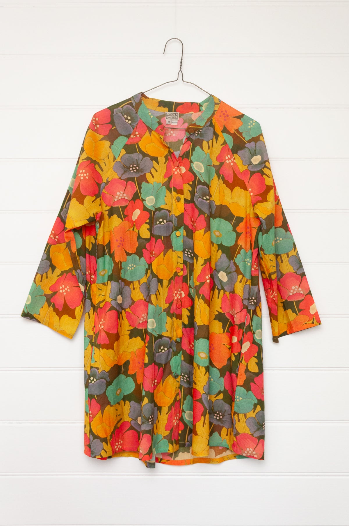 Neeru Kumar button-up shirt with a colorful floral pattern.