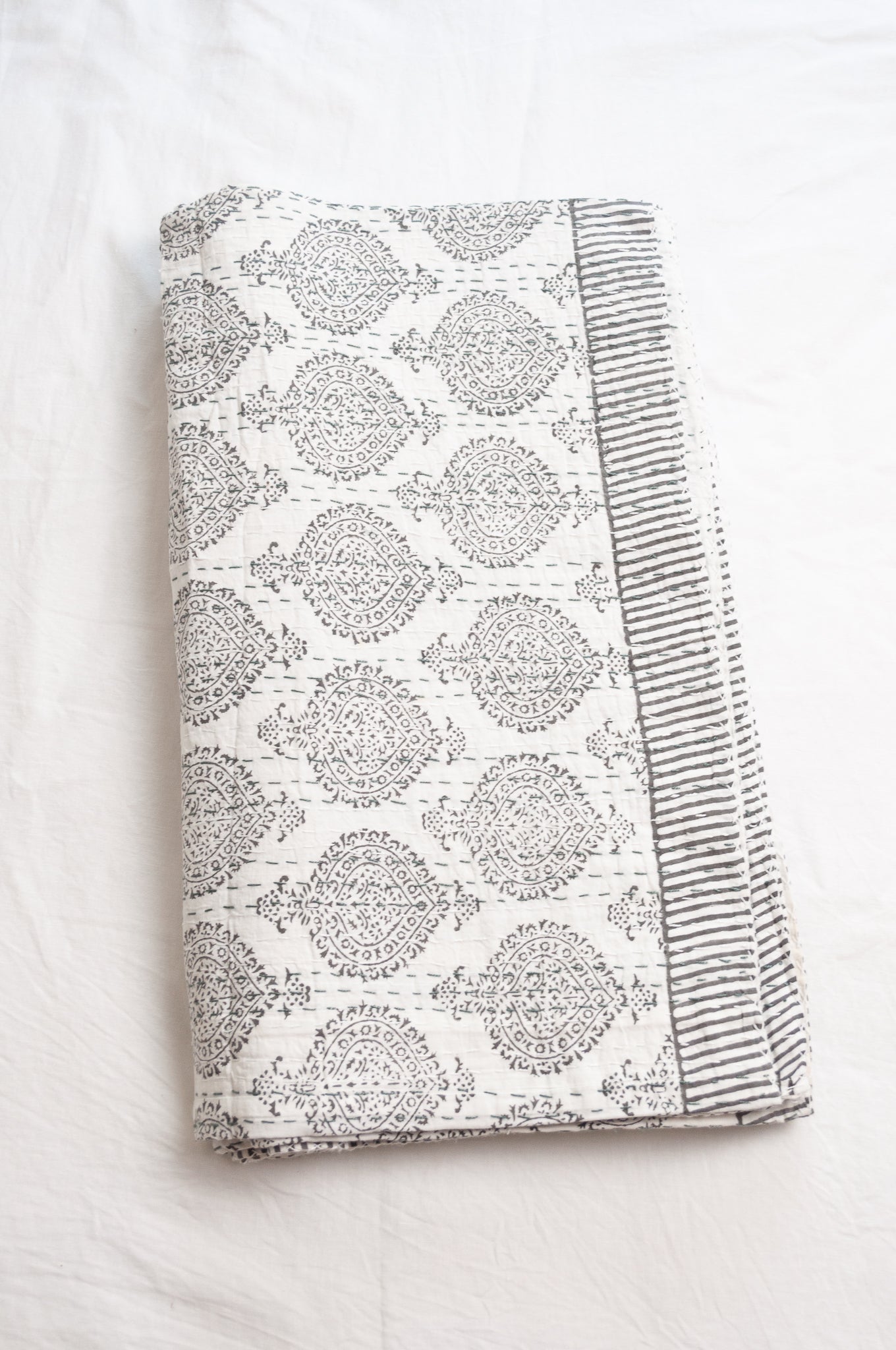 Kantha quilt blockprint pure cotton in pewter grey on white pattern.