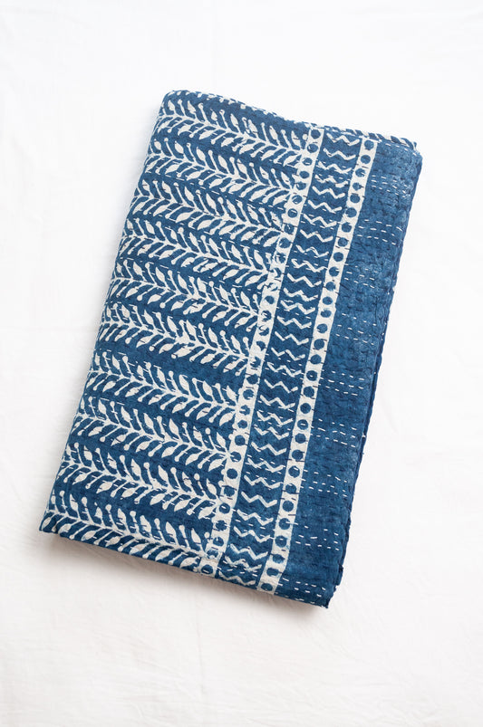 Pure cotton indigo kantha quilt hand stitched with vertical vine design and patterned border.