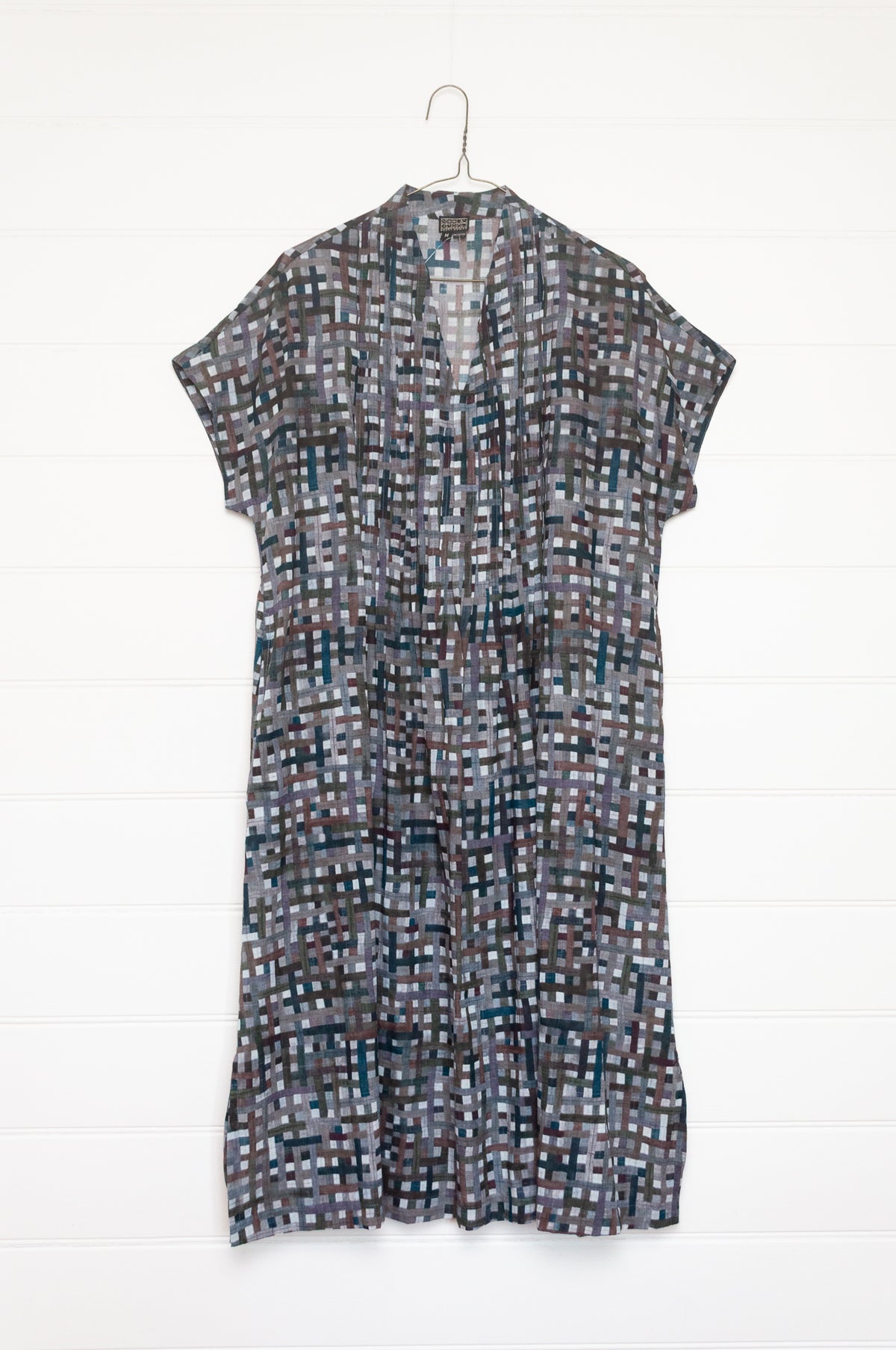 Neeru Kumar fine cotton pintucked  cap sleeved dress in charcoal and brown checks with teal highlights.