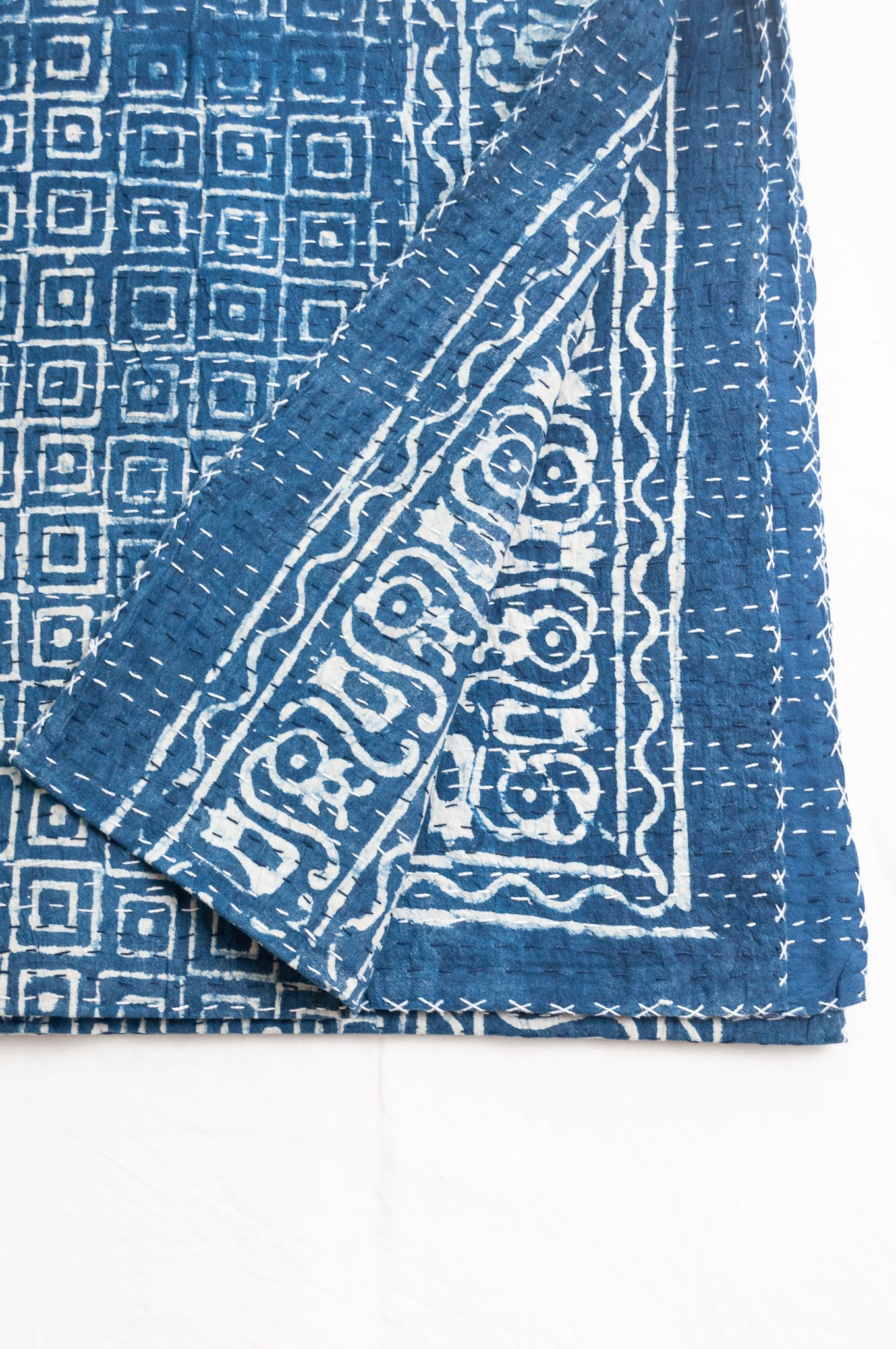Indigo blue and white pure cotton kantha stitch bed quilt with squares design.