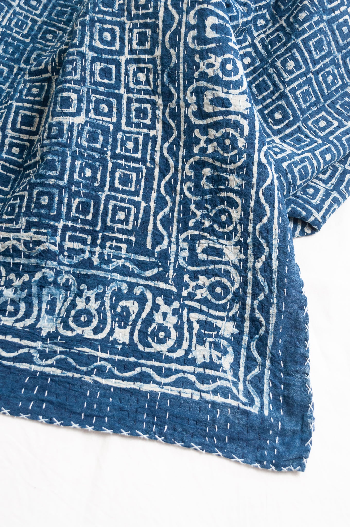 Indigo blue and white pure cotton kantha stitch bed quilt with squares design.