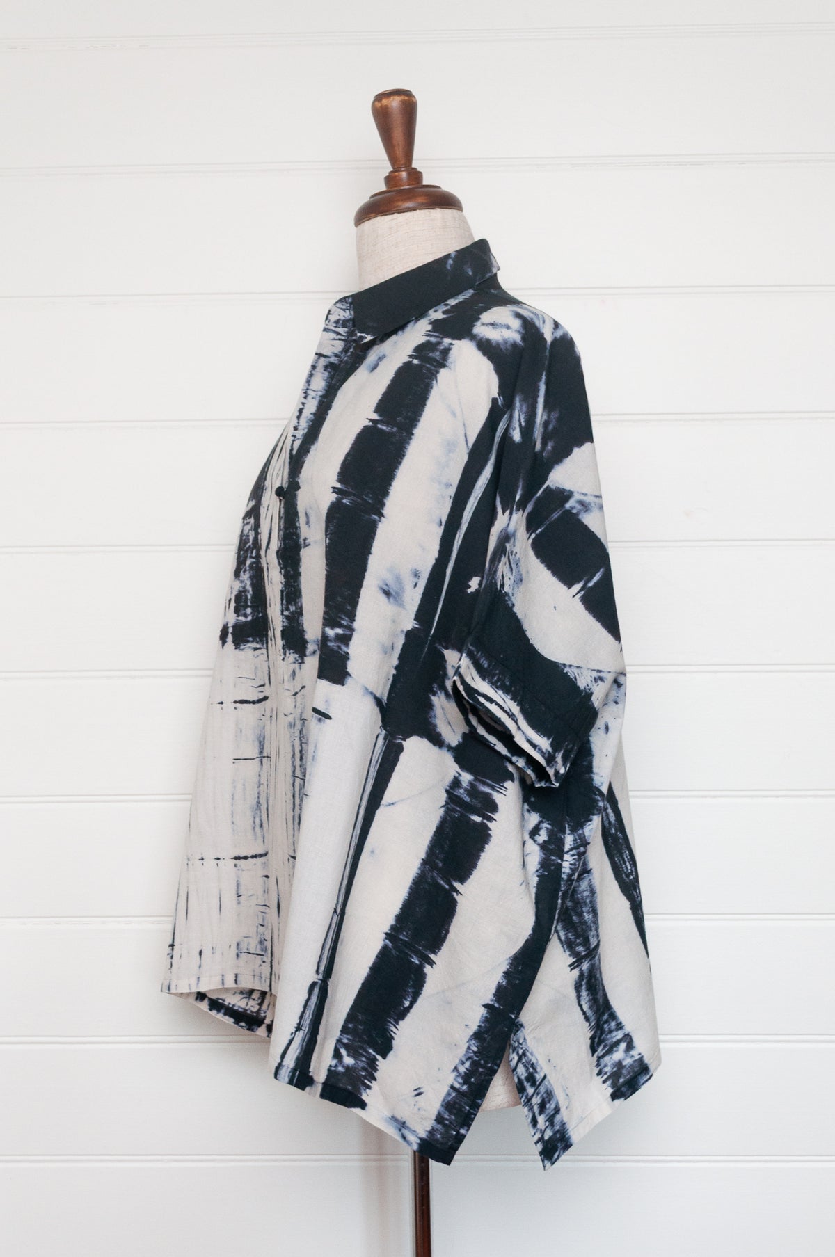 Neeru Kumar short-sleeve collared shirt with a black and white shibori tie-dye pattern.
