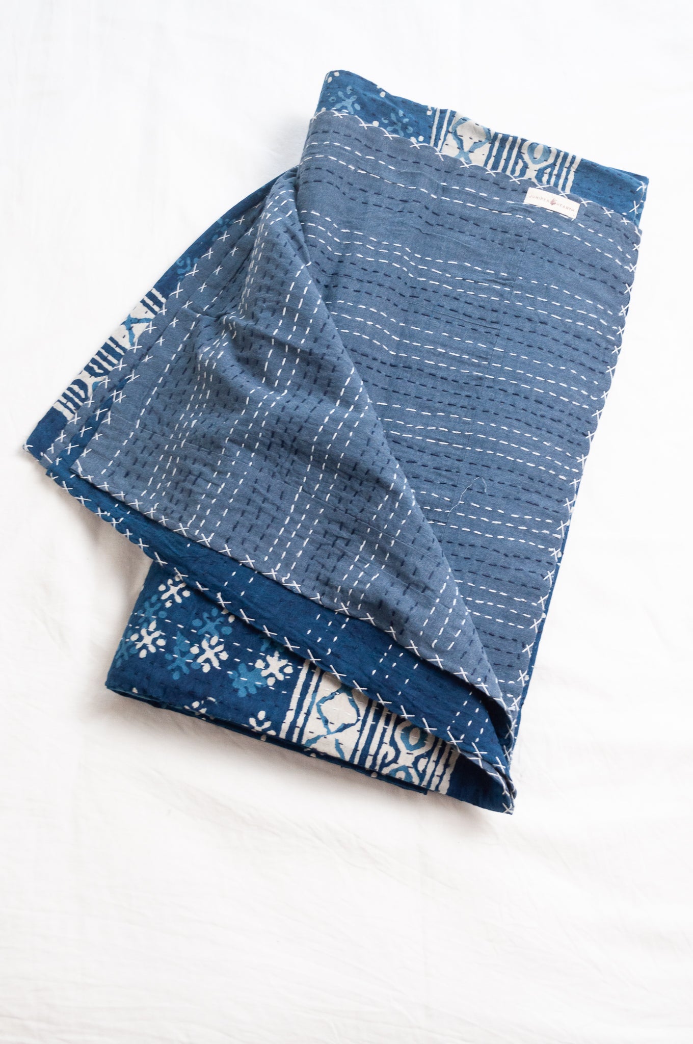 Indigo blue and white pure cotton kantha stitch bed quilt with diamond dot design.