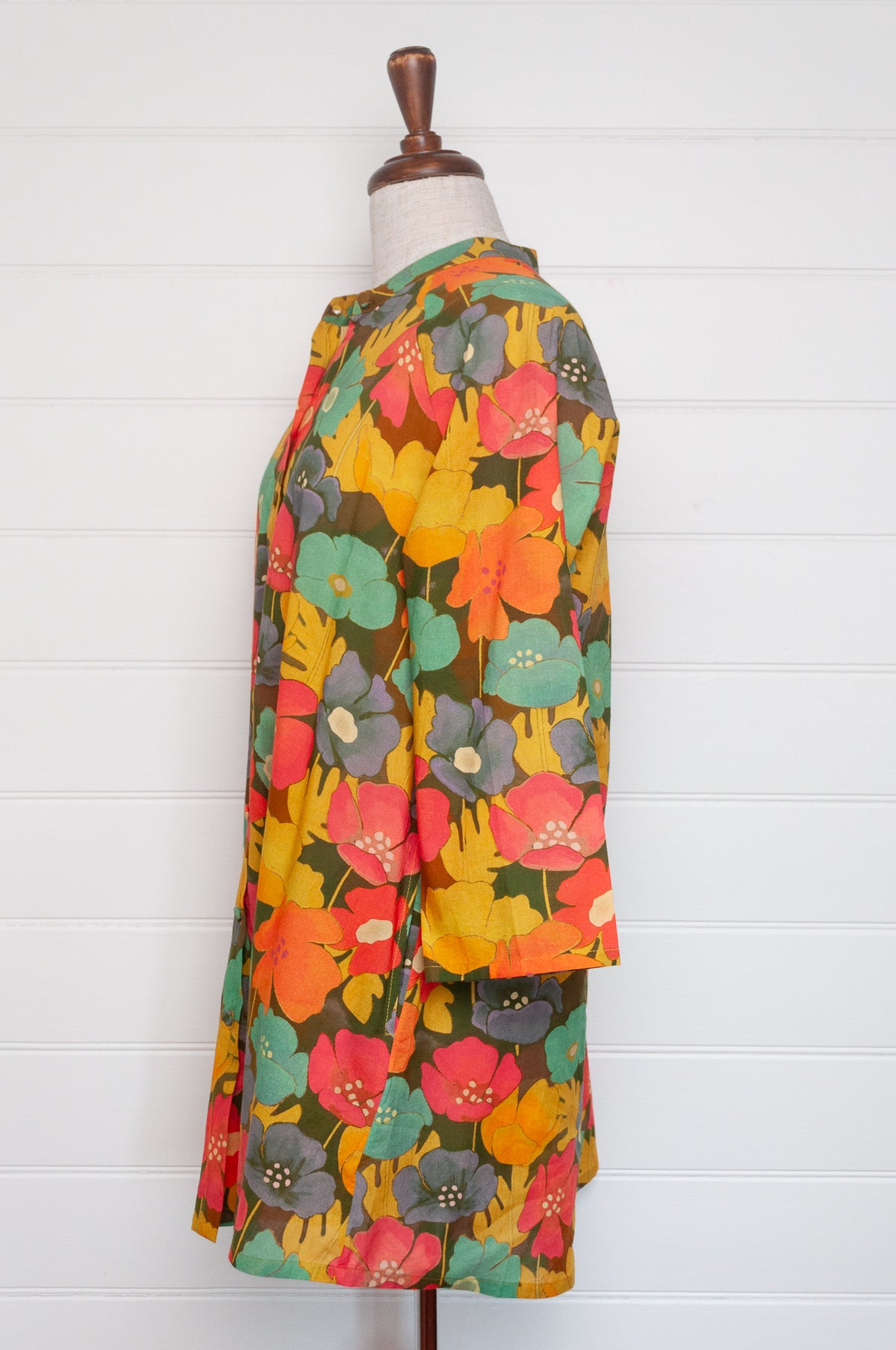 Neeru Kumar button-up shirt with a colorful floral pattern.