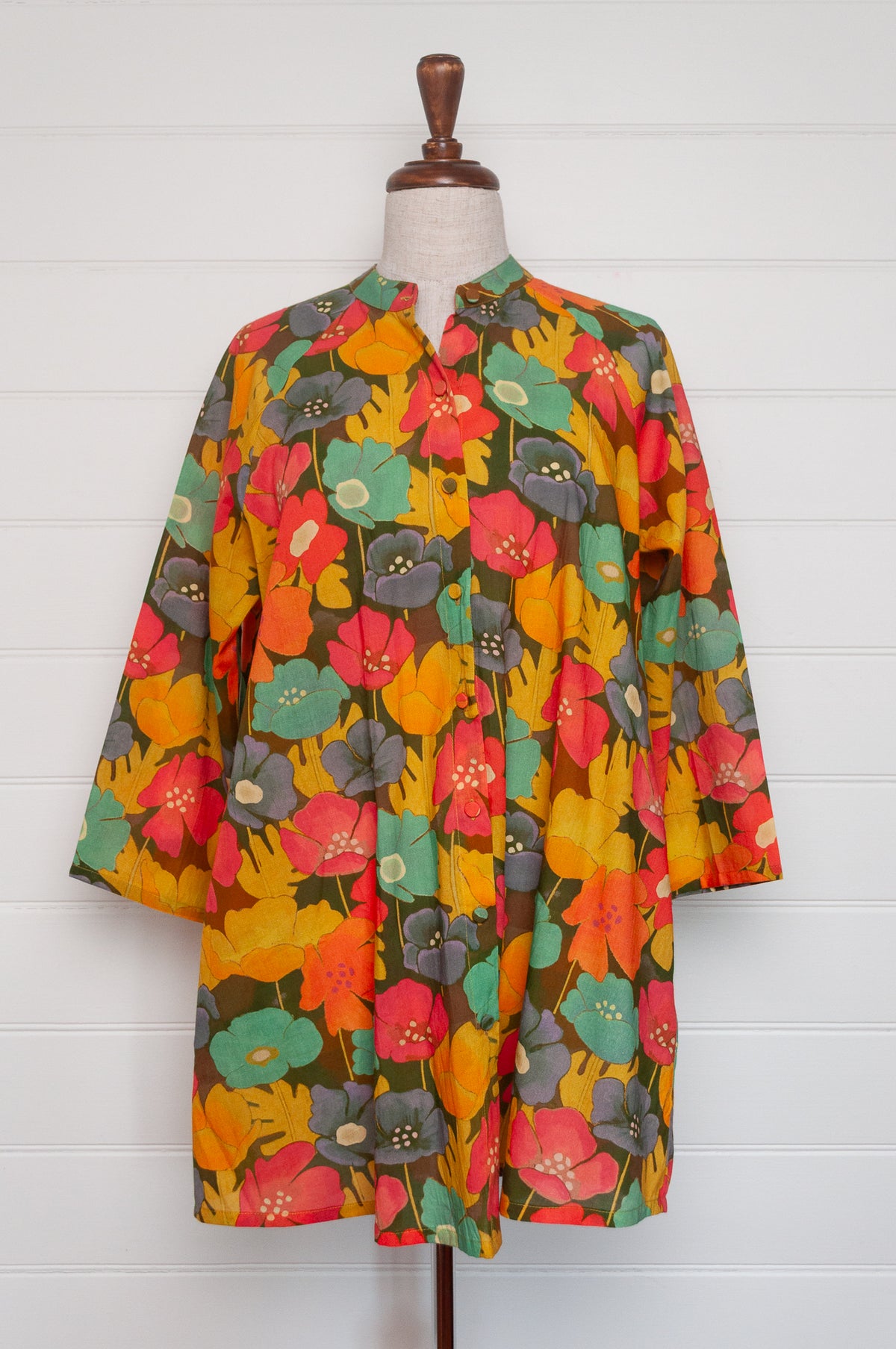 Neeru Kumar button-up shirt with a colorful floral pattern.