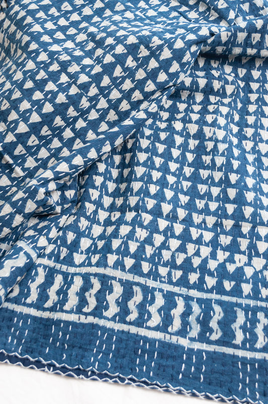 Indigo blue and white pure cotton kantha stitch bed quilt with triangle design.