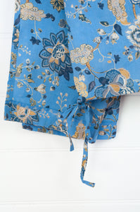 Juniper Hearth cotton voile pyjamas in Magenta sky floral print on sky blue.