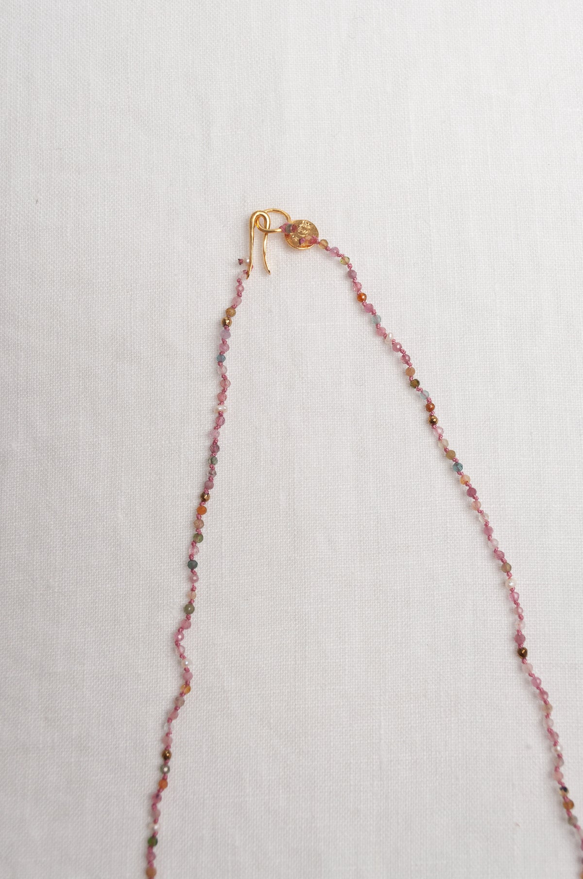 Mary Gaitani handmade tourmalines necklace with gold charms.