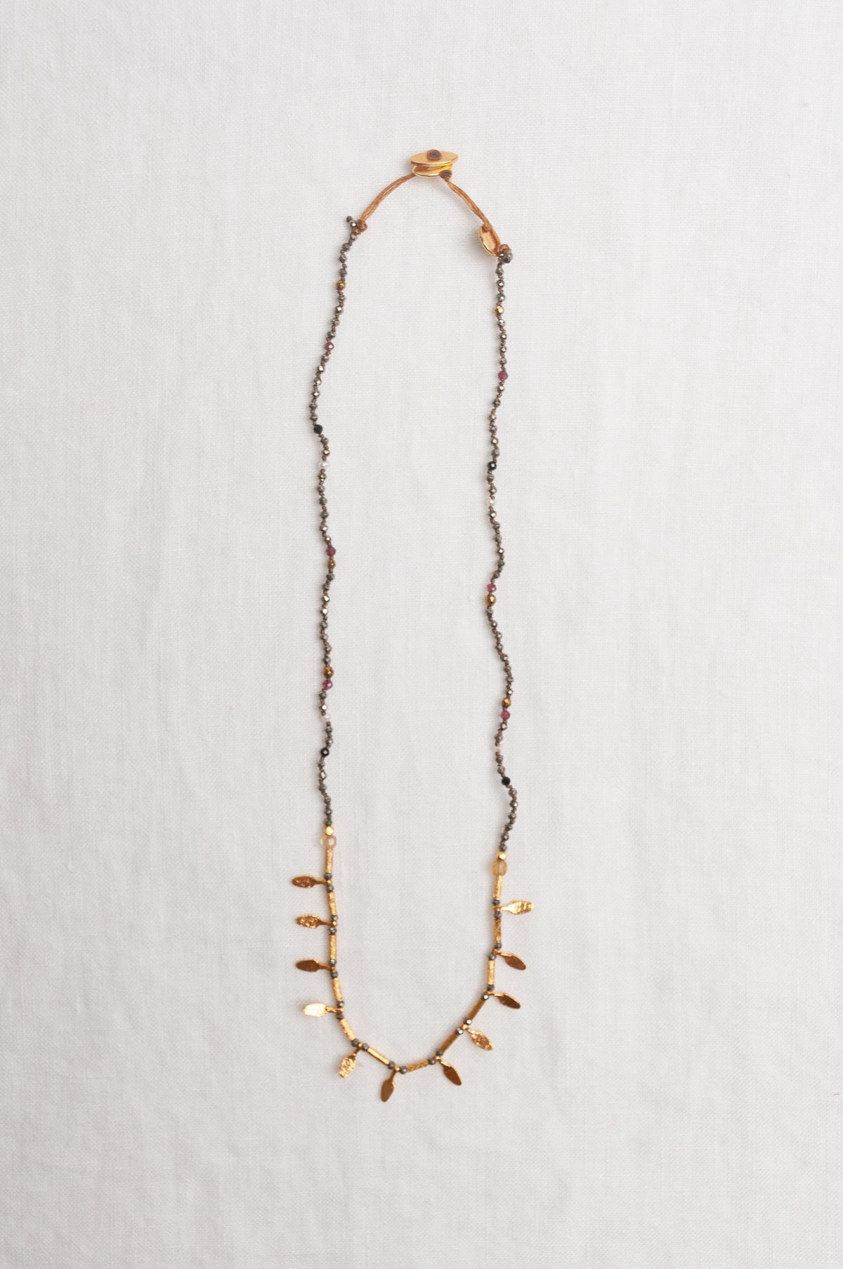 Mary Gaitani handmade pyrite necklace with gold charms.