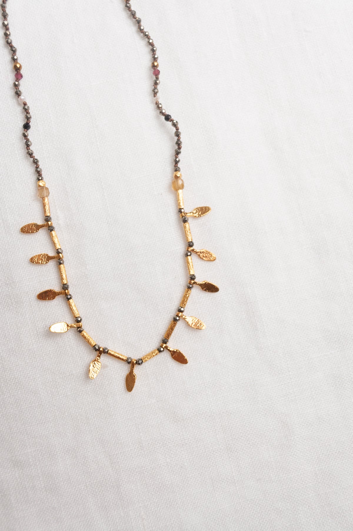 Mary Gaitani handmade pyrite necklace with gold charms.