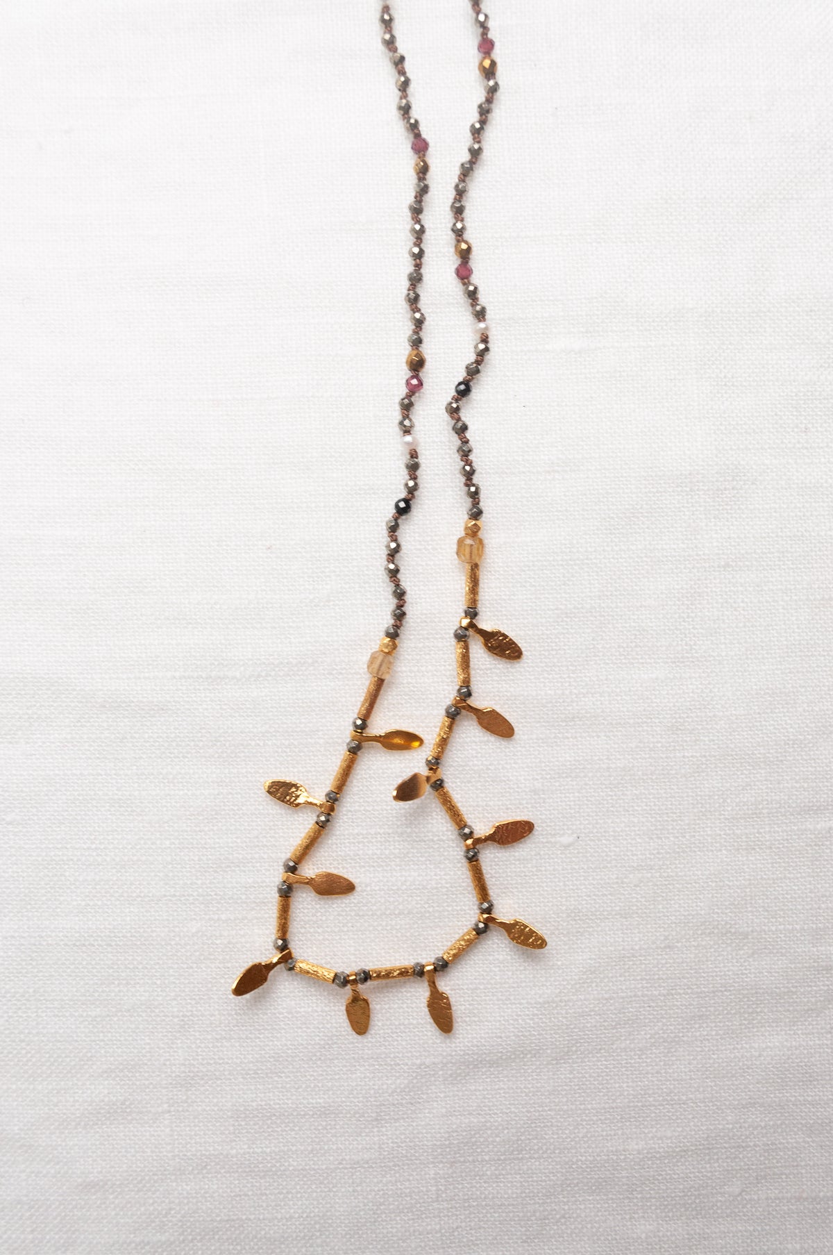 Mary Gaitani handmade pyrite necklace with gold charms.
