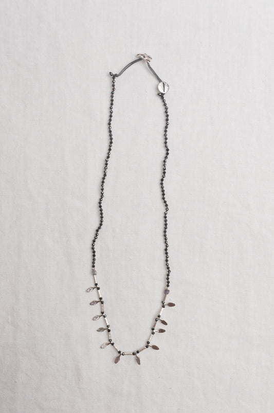 Mary Gaitani handmade grey spinels necklace with silver charms.