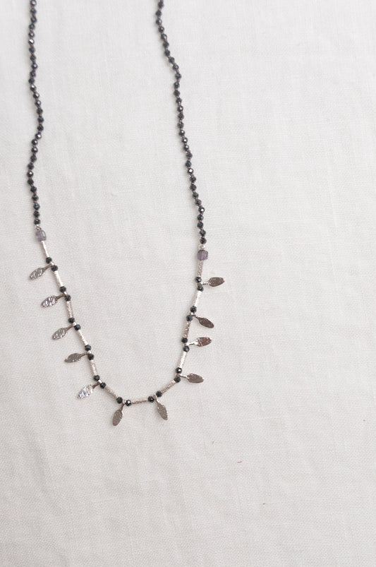 Mary Gaitani handmade grey spinels necklace with silver charms.