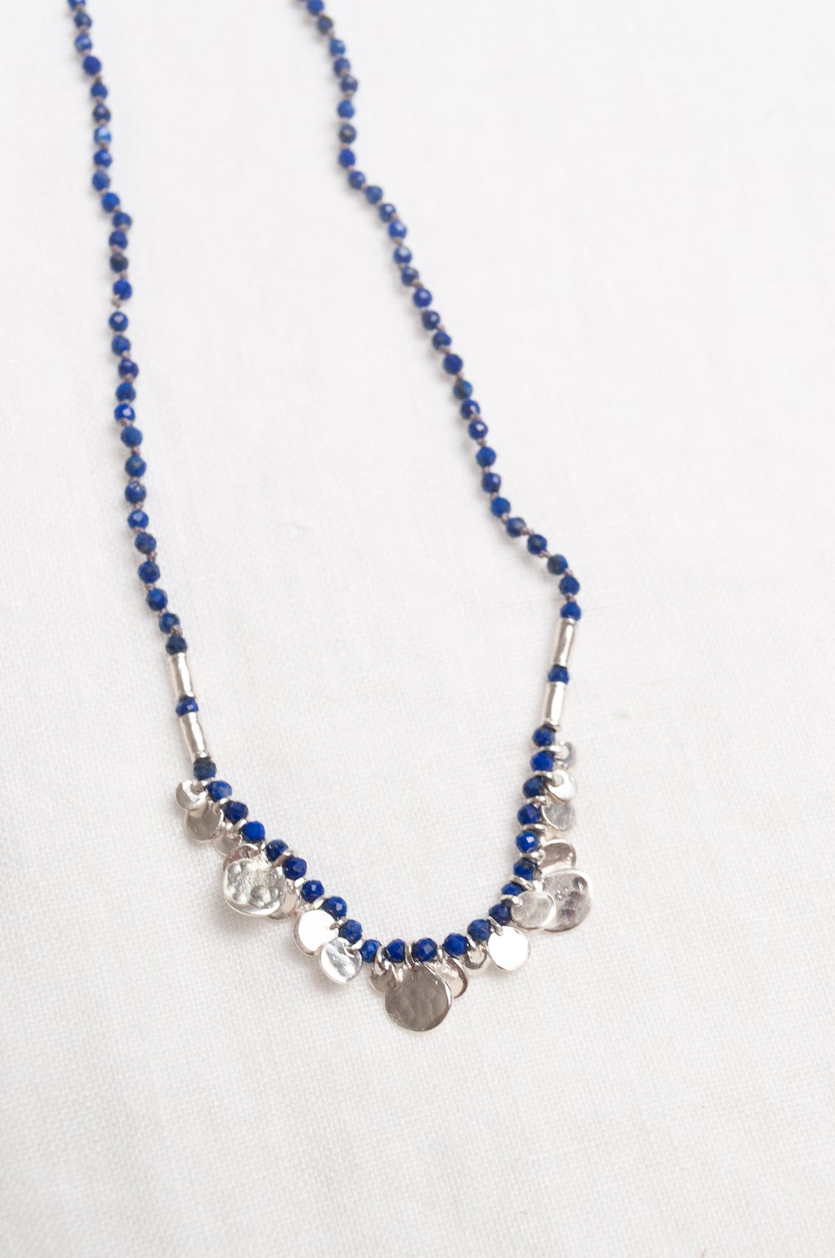 Mary Gaitani handmade lapis necklace with silver charms.