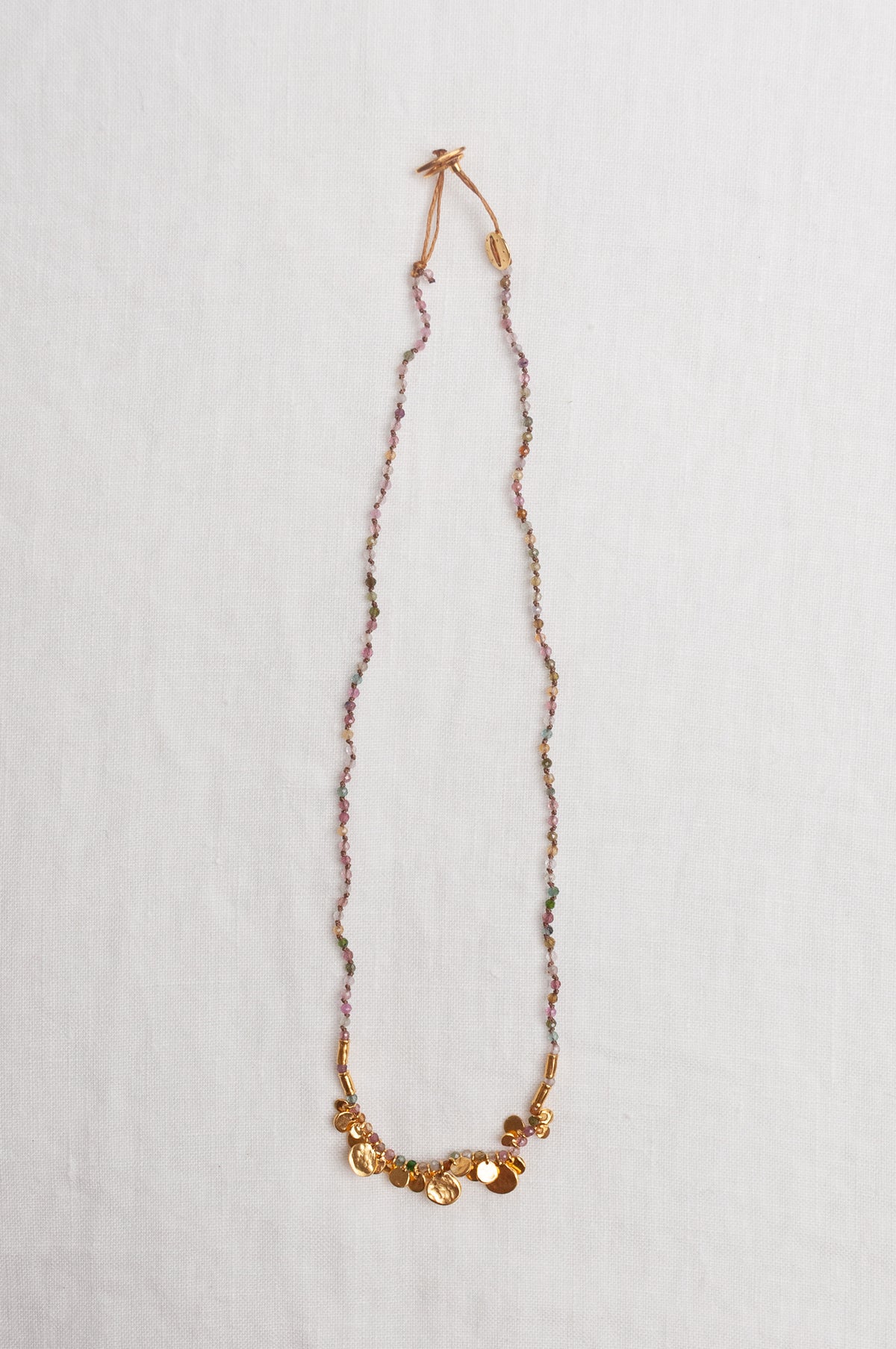 Mary Gaitani handmade tourmalines necklace with gold charms.
