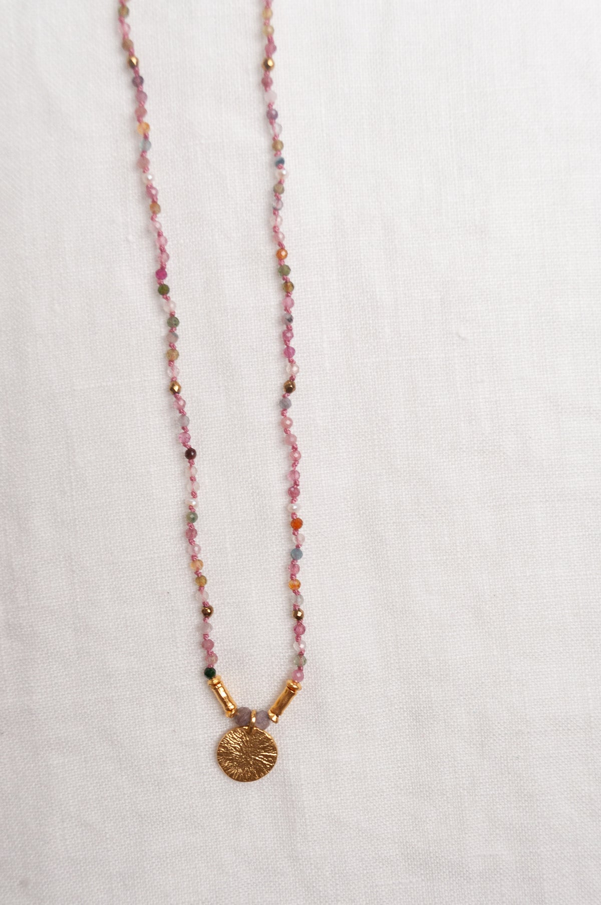 Mary Gaitani handmade tourmalines necklace with gold charms.