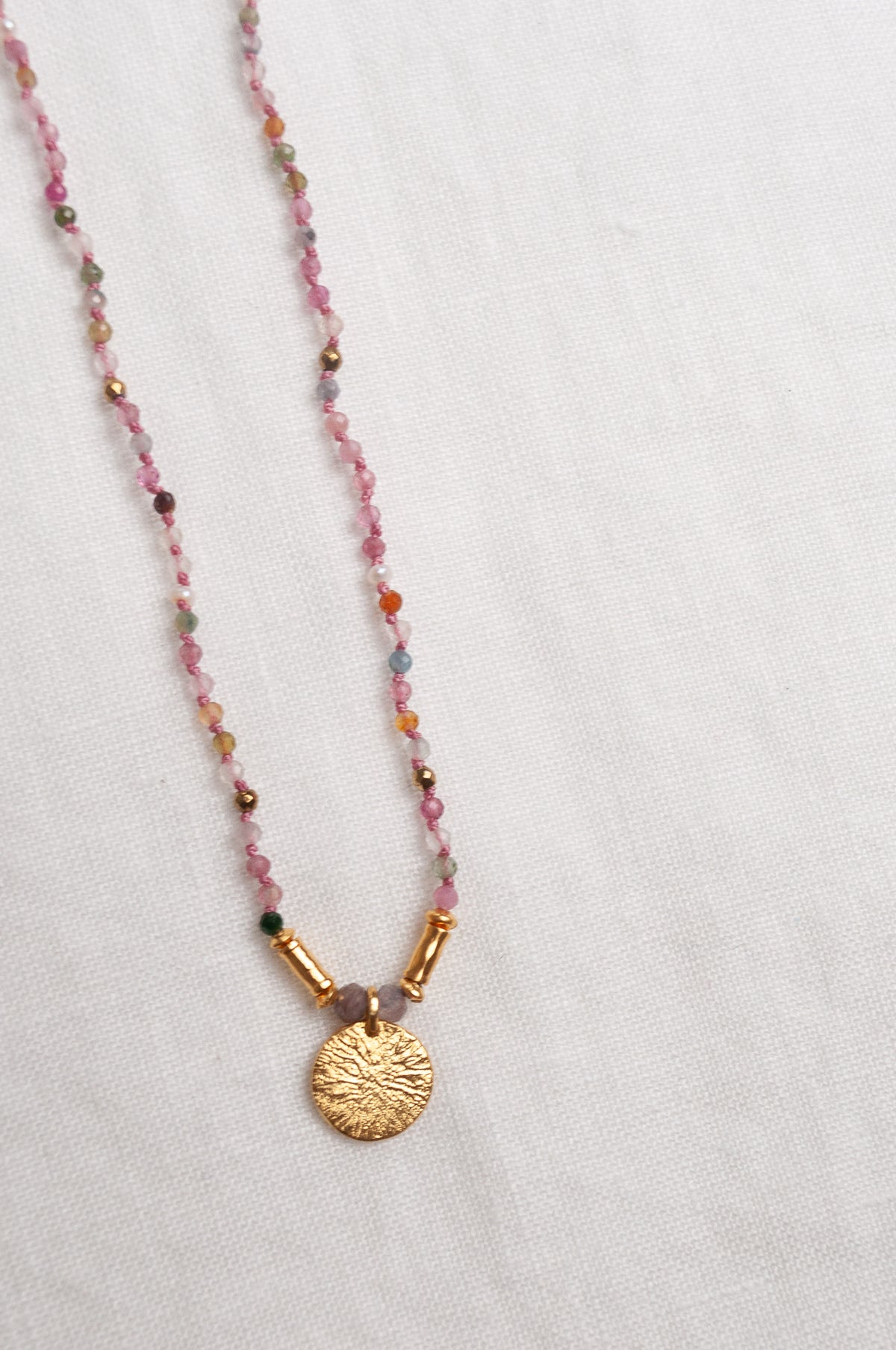 Mary Gaitani handmade tourmalines necklace with gold charms.