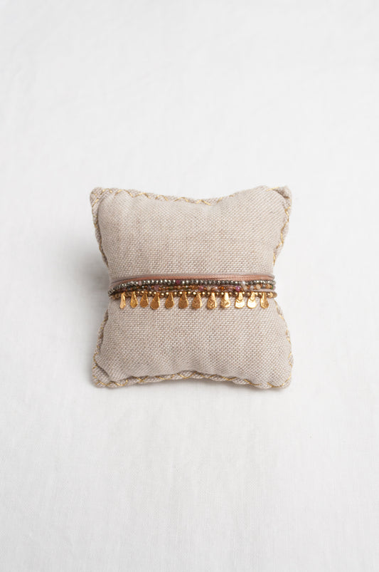 Mary Gaitani hand tooled gold teardrop charms on stranded cords with semi-precious stones.