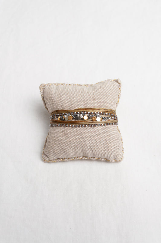 Mary Gaitani stranded wax cord bracelet with semi-precious stones and gold and silver charms.