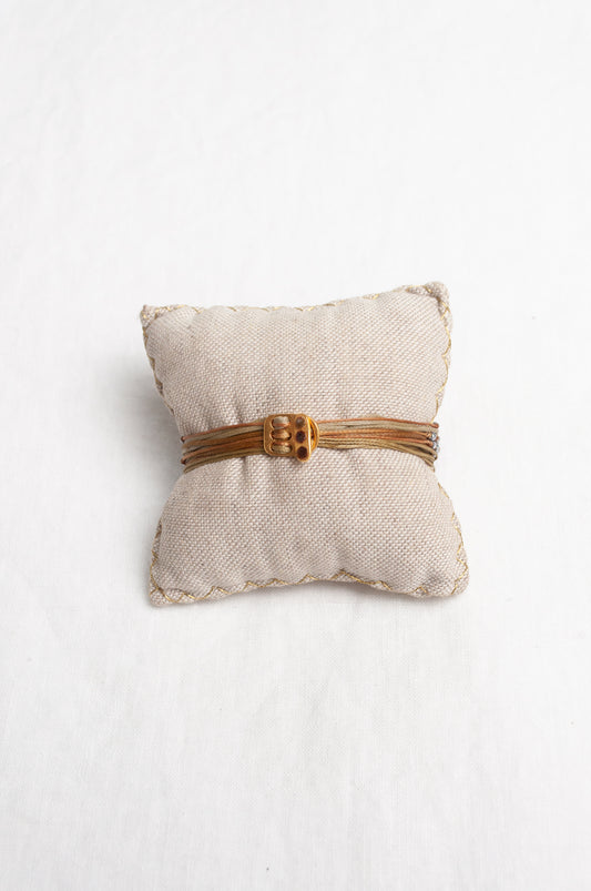Mary Gaitani stranded wax cord bracelet with semi-precious stones and gold and silver charms.