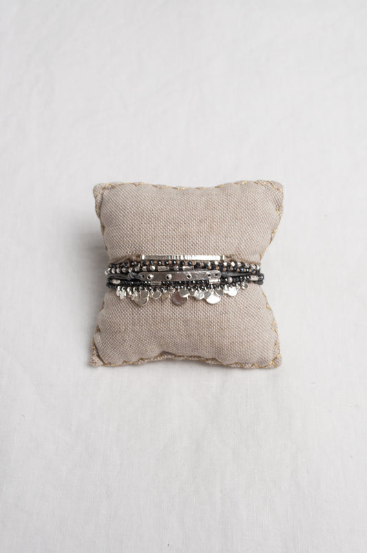 Mary Gaitani stranded wax cord bracelet with semi-precious stones and silver charms.