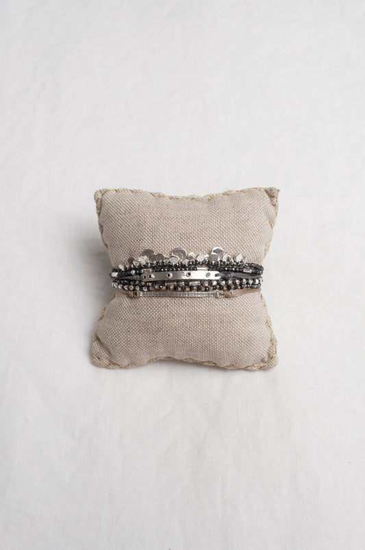 Mary Gaitani stranded wax cord bracelet with semi-precious stones and silver charms.
