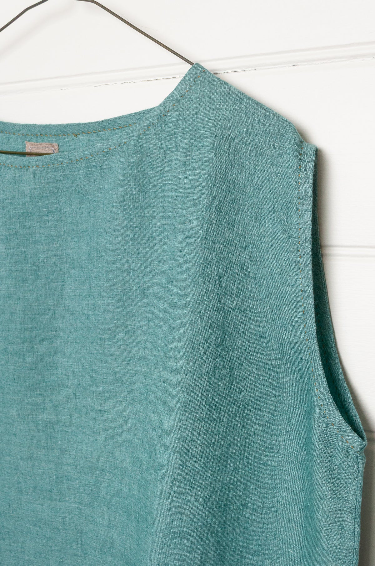 DVE Aishani one size crop sleeveless top in mineral green handloom linen.