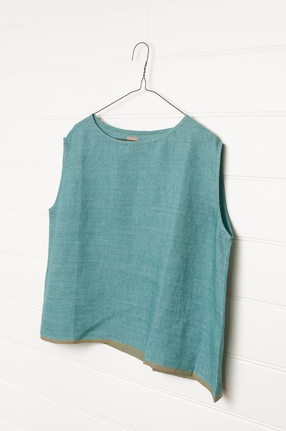 DVE Aishani one size crop sleeveless top in mineral green handloom linen.