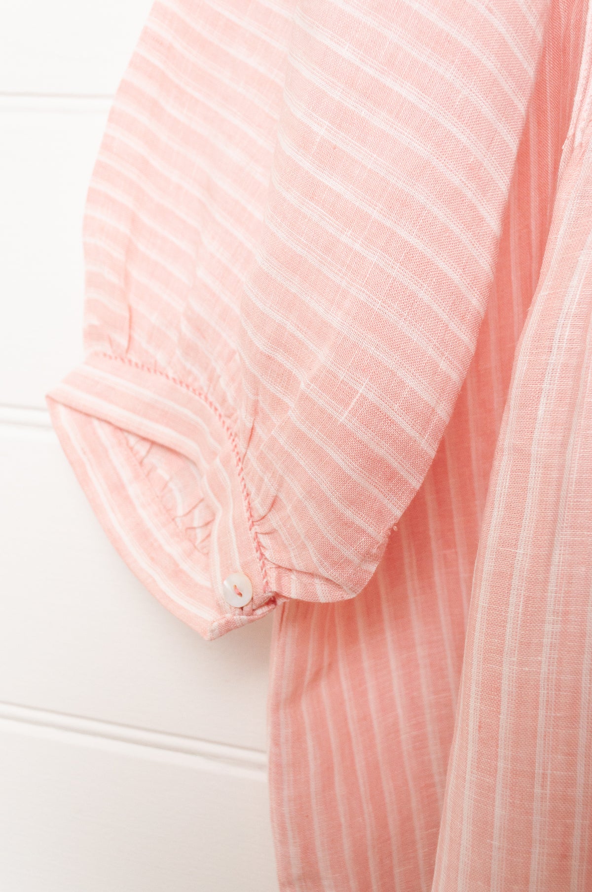 DVE Anisha pintuck linen top in rose pink and white stripe, with three quarter sleeves and hand stitched details.