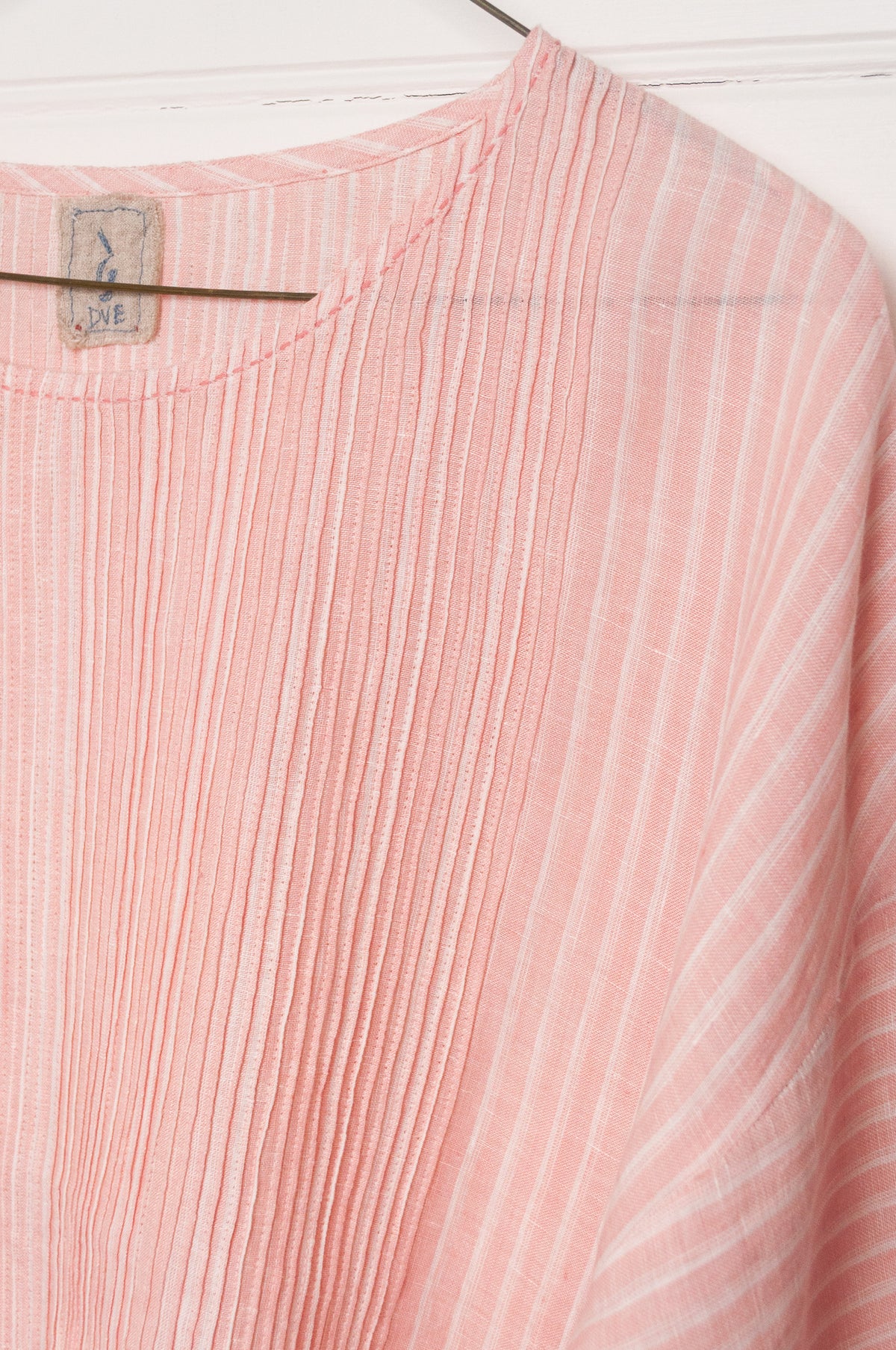 DVE Anisha pintuck linen top in rose pink and white stripe, with three quarter sleeves and hand stitched details.
