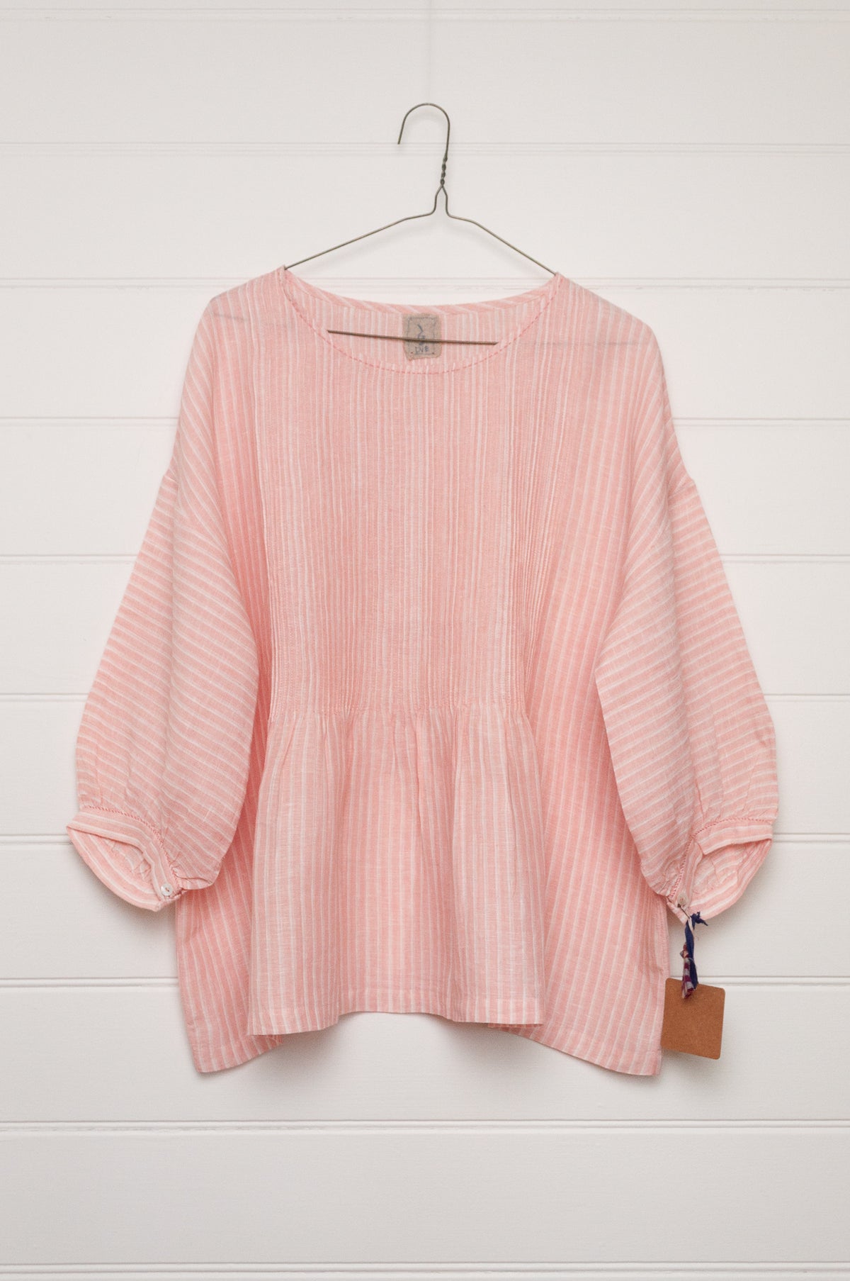 DVE Anisha pintuck linen top in rose pink and white stripe, with three quarter sleeves and hand stitched details.