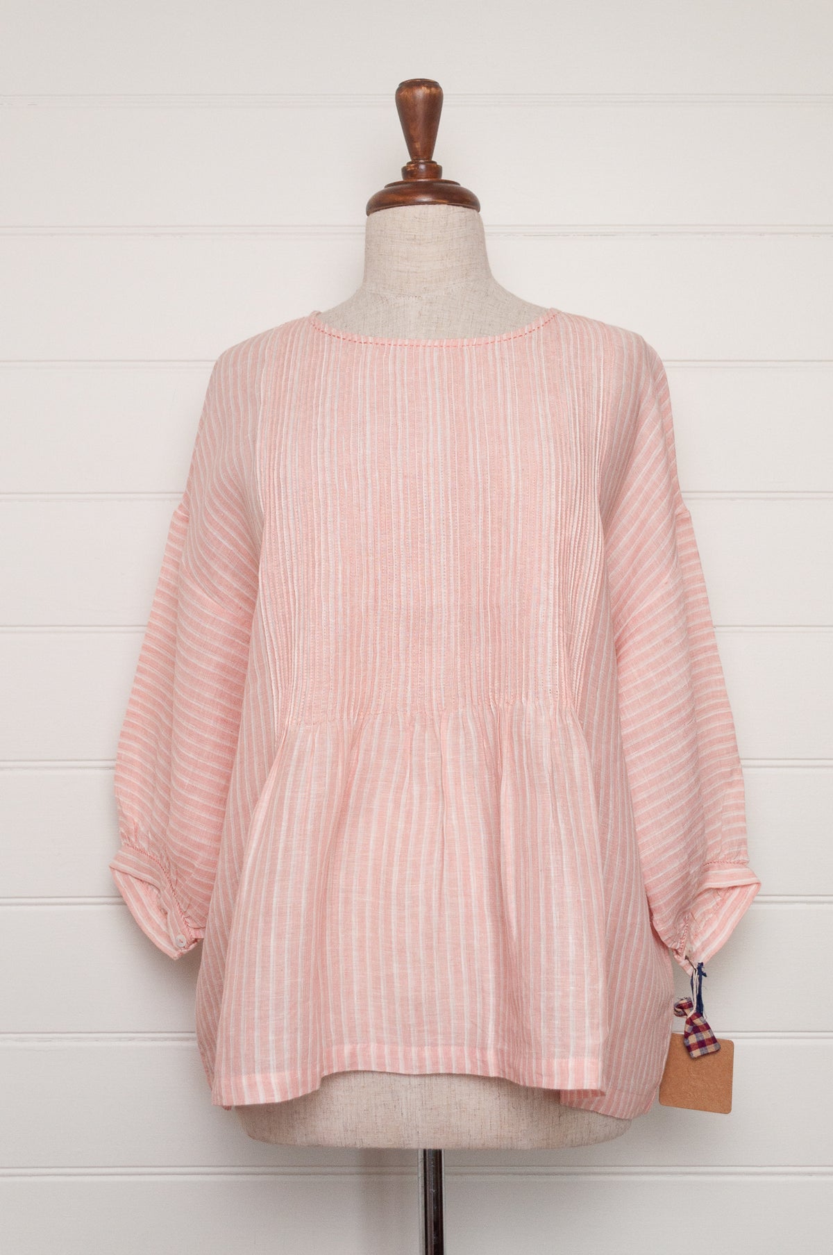 DVE Anisha pintuck linen top in rose pink and white stripe, with three quarter sleeves and hand stitched details.