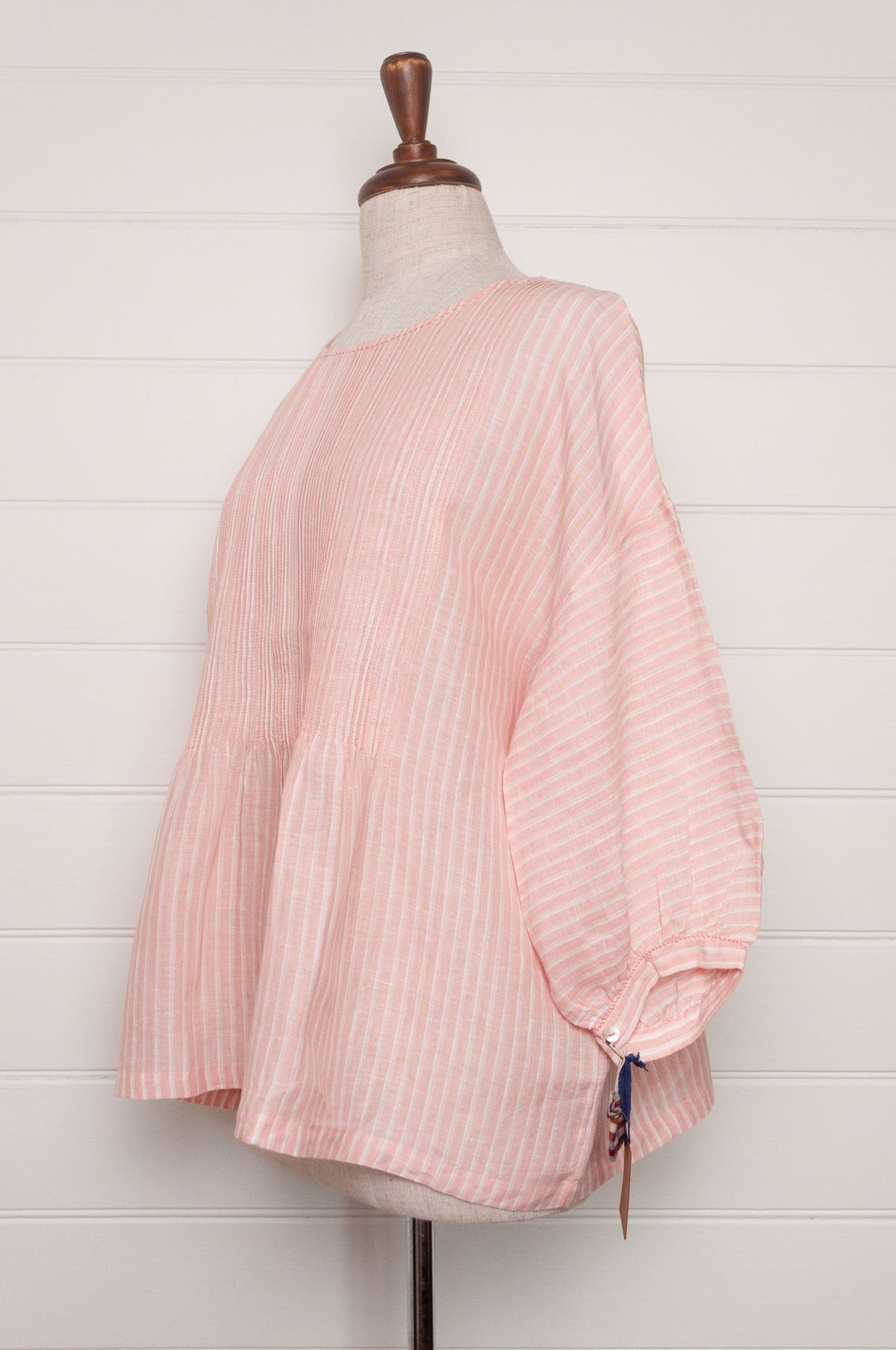 DVE Anisha pintuck linen top in rose pink and white stripe, with three quarter sleeves and hand stitched details.