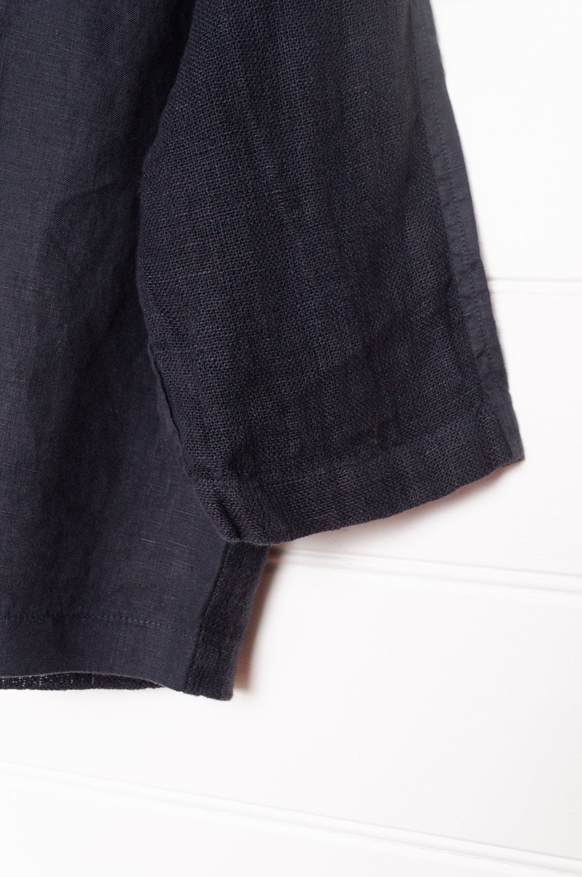 Valia pure linen Port Fairy jacket made in Melbourne with round neck, gauze panels and button closure in deep navy blue.