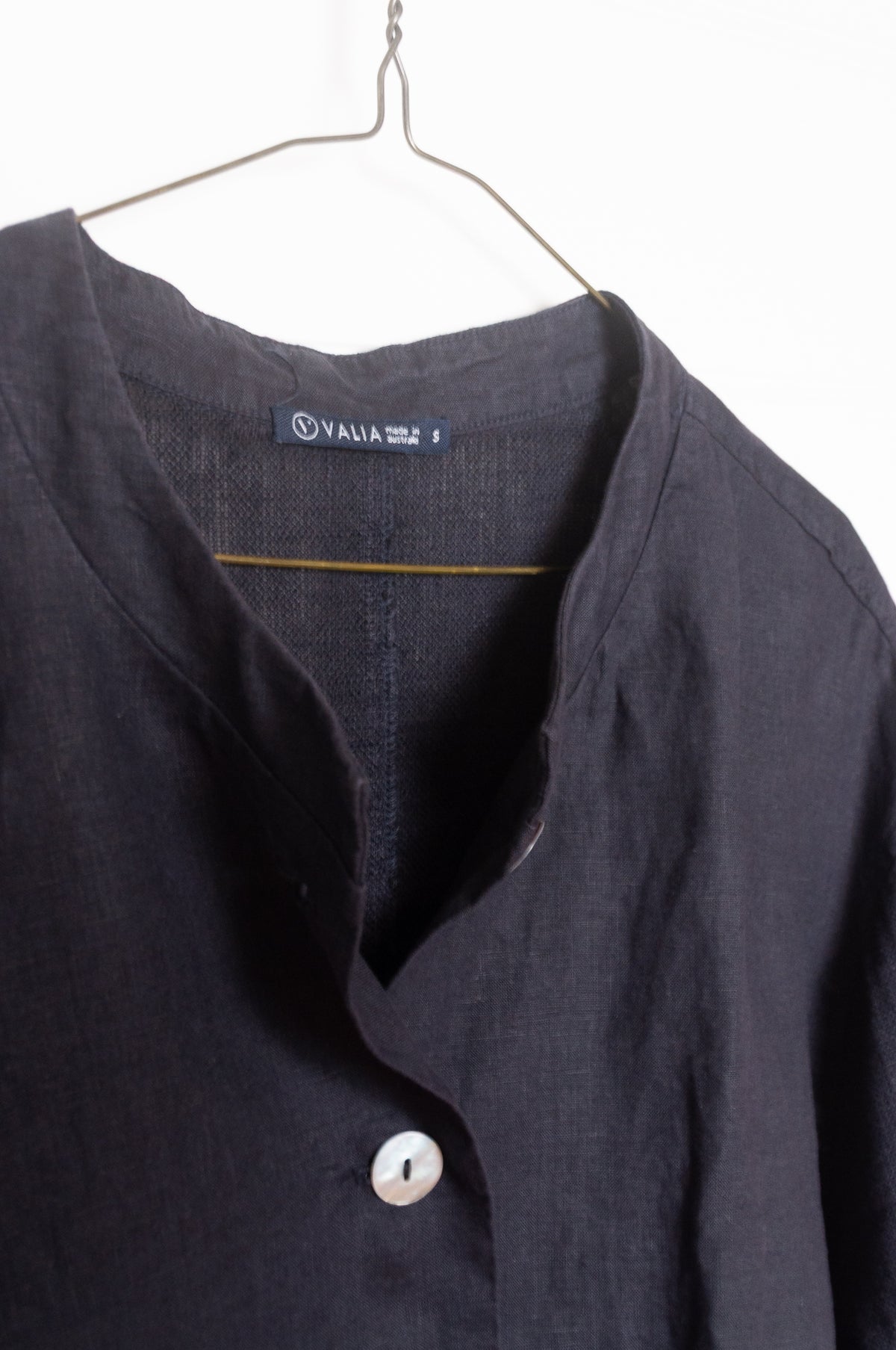 Valia pure linen Port Fairy jacket made in Melbourne with round neck, gauze panels and button closure in deep navy blue.