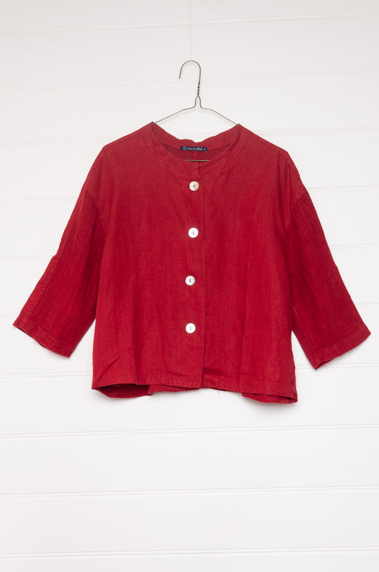 Valia pure linen Port Fairy jacket made in Melbourne with round neck, gauze panels and button closure in ketchup red.