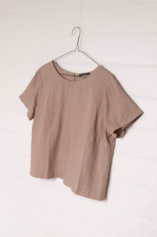 Valia pure linen made in Melbourne crop short sleeve blouse with round neck and button closure at back neck, in beige tan.
