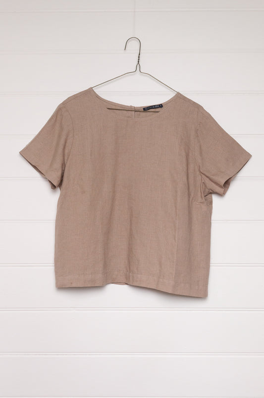 Valia pure linen made in Melbourne crop short sleeve blouse with round neck and button closure at back neck, in beige tan.