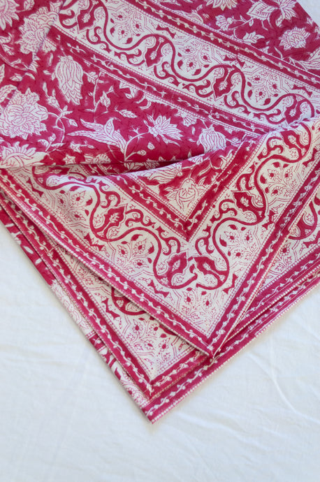 Blockprinted  cotton table cloth in raspberry red and white floral design, made by hand