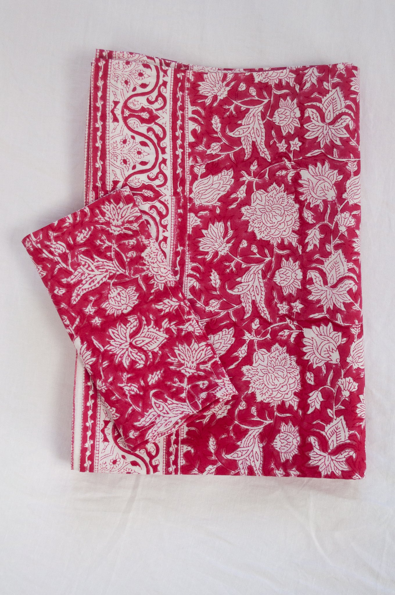 Blockprinted  cotton table cloth in raspberry red and white floral design, made by hand