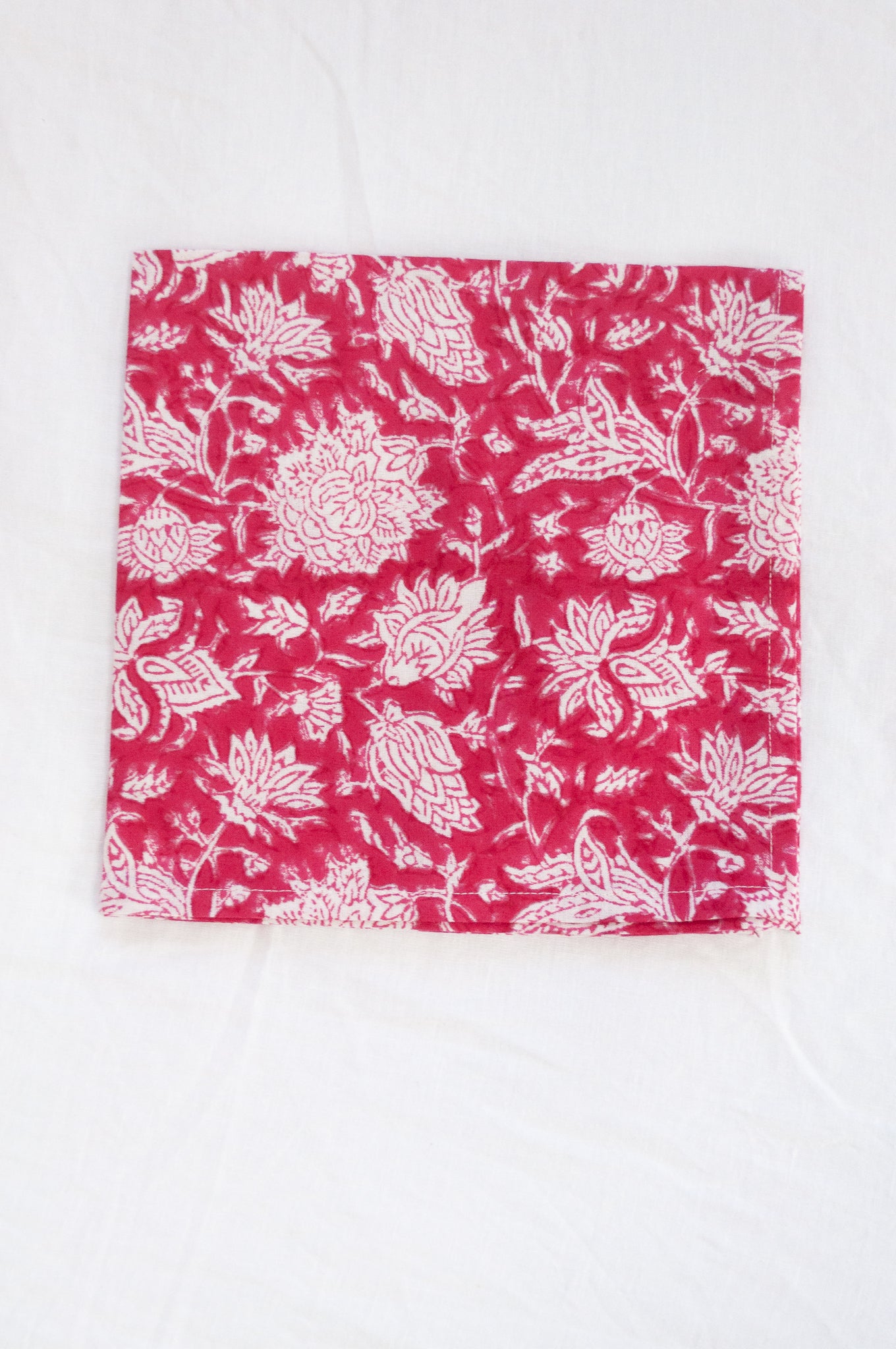 Blockprinted  cotton napkins in raspberry red and white floral design, made by hand.