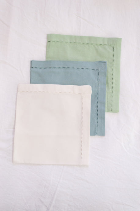 Plain cotton napkins with faggot hem detail in three colours, white, celadon and sage.