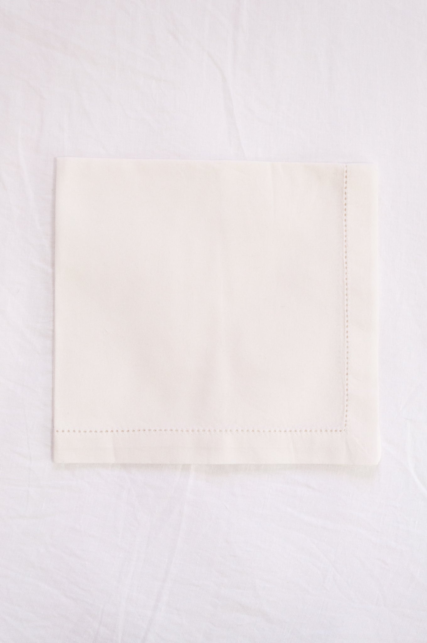 Plain cotton napkins with faggot hem detail in white.